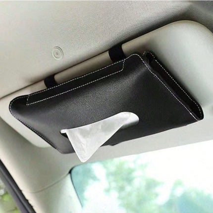 Car visor tissue holder with tissue on a car dashboard