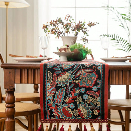 Decorative table runner with floral patterns on a wooden dining table.